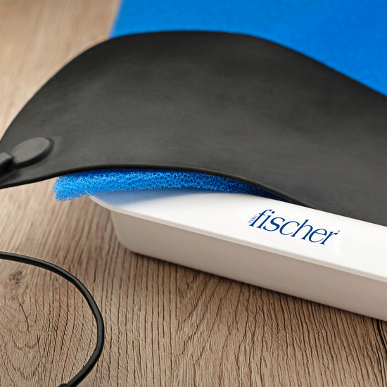 image of the Fischer iontophoresis device, used to treat hyperhidrosis (excessive sweating).  In focus is the black silicone graphite electrodes. 
