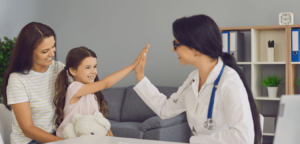 Pediatrician high fiving young girl on mothers lap. fischer medical supply urology iontophoresis